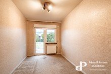Zimmer mit Terrassenzugang **KETTENBUNGALOW IN SPLITTLEVELBAUWEISE MIT GARTEN, BALKON UND DOPPELGARAGE IN WOLFENB�TTEL**